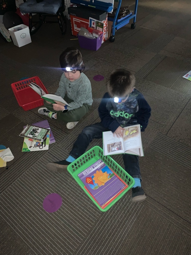 Mrs. Tietjen’s Kindergarten class enjoying “Flashlight Friday” reading