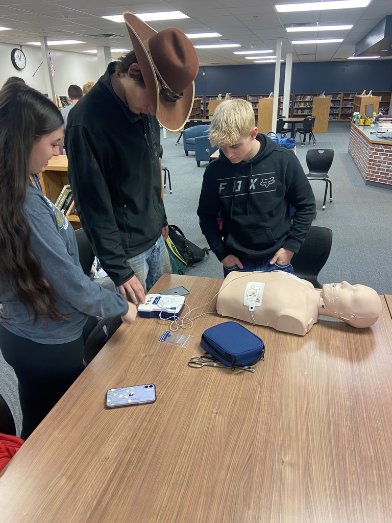 Students follow the instructions of the AED.  
